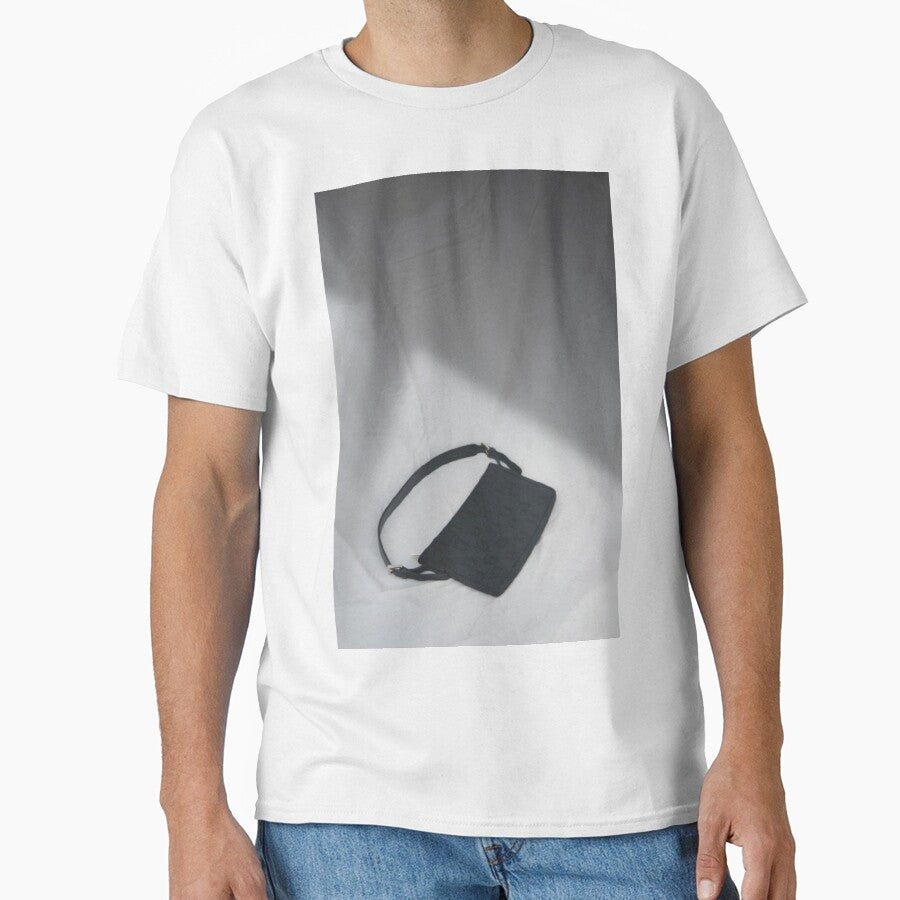 Black handbag on white background by julidescole